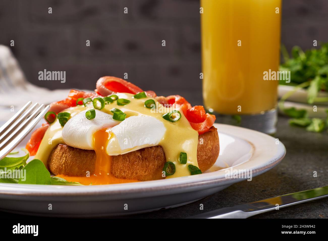 Eggs Benedict with salmon and hollandaise sauce Stock Photo
