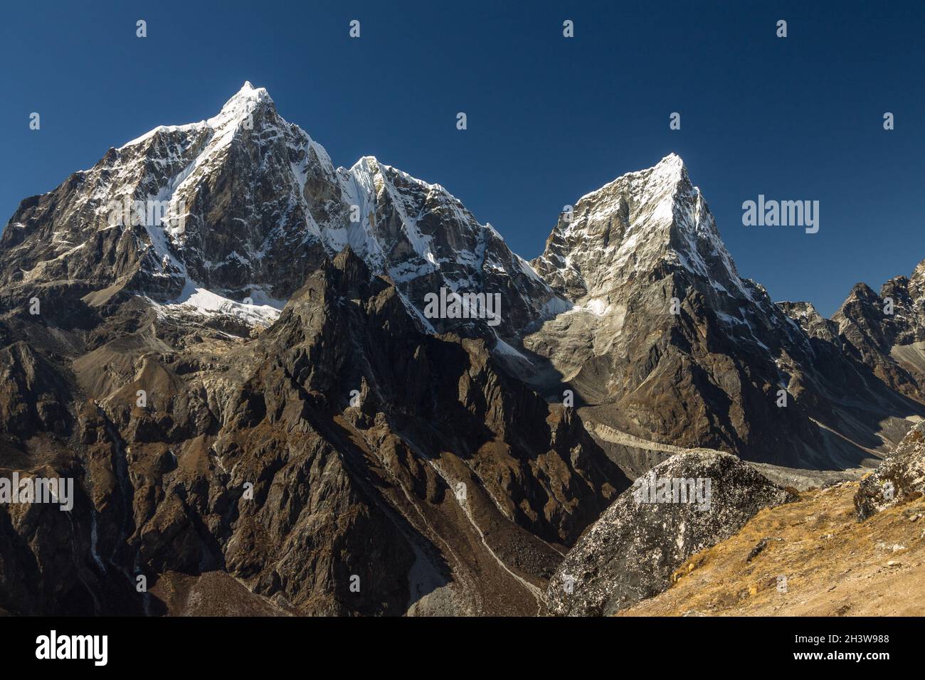 Taboche and Cholatse seen from Nangkartshang Stock Photo
