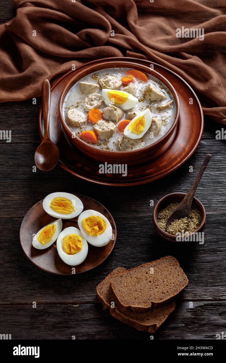 Zurek polish fermented rye soup with traditional polish white kielbasa