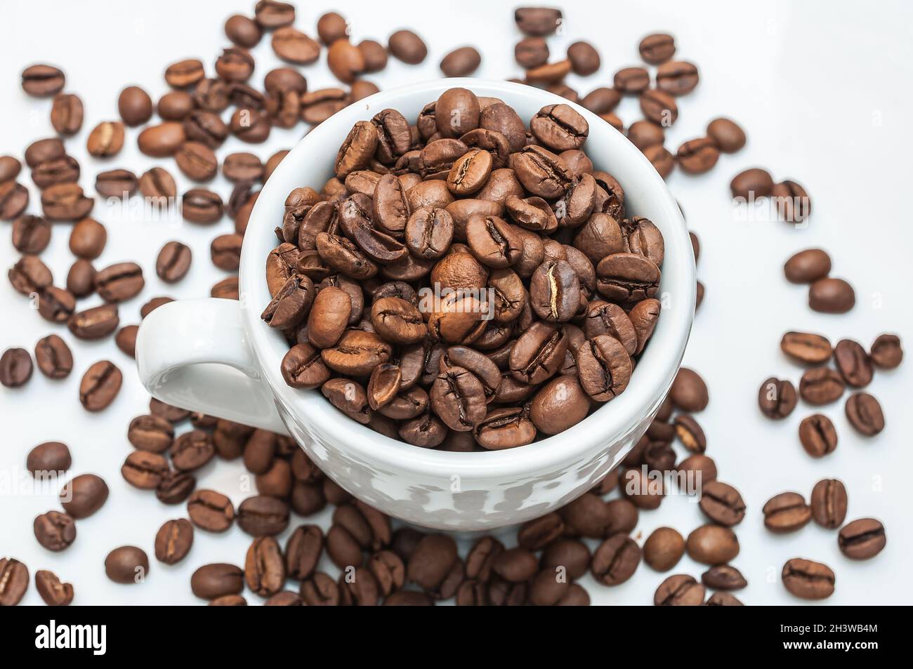 Roasted coffee beans in a cup Stock Photo