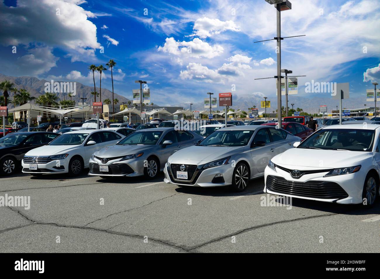 Car Rental vehicles parked at Palm Springs International Airport, California Stock Photo