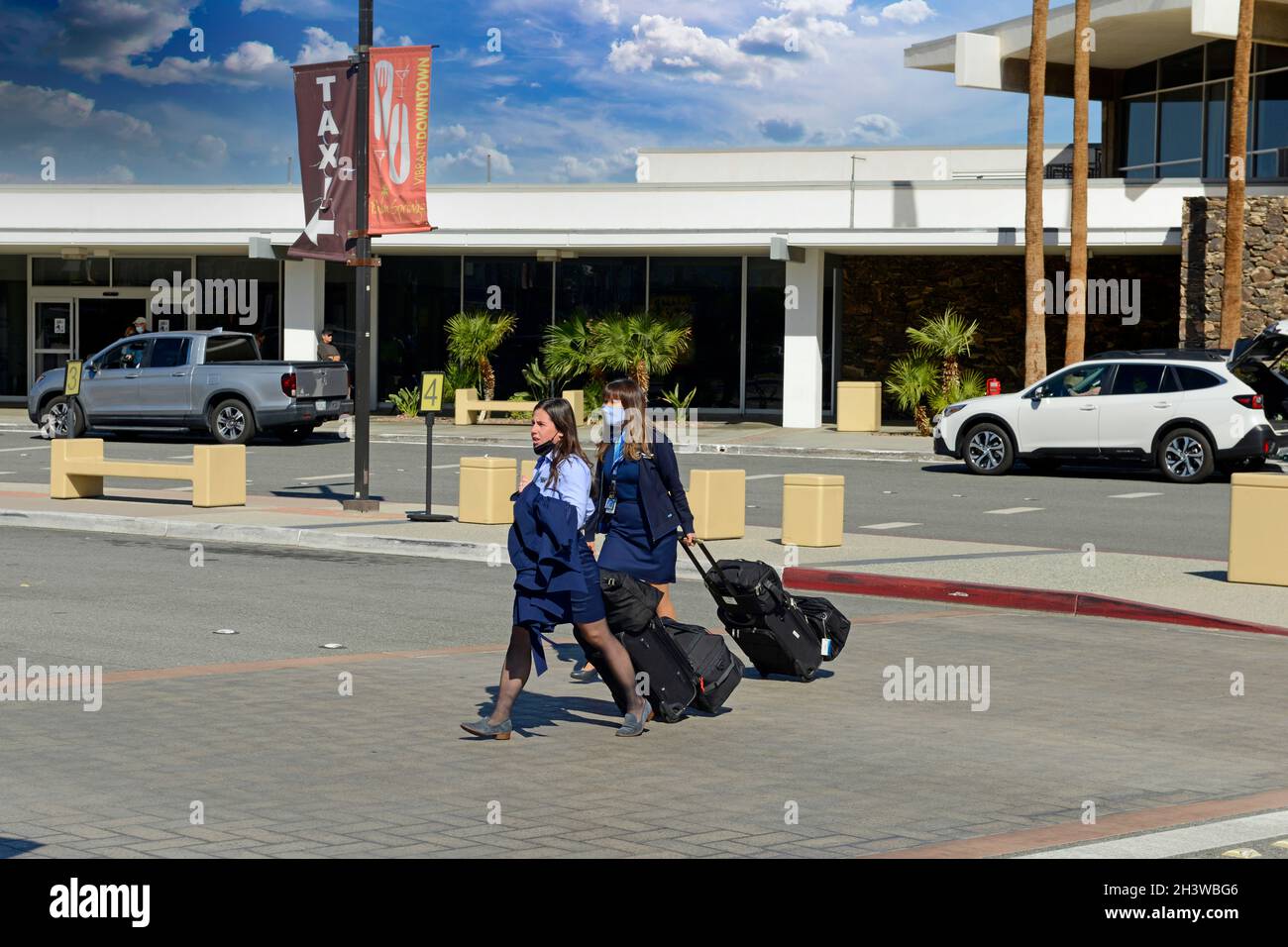 Southwest Airlines female flight crew exiting the Palm Springs International Airport, after a flight. Stock Photo
