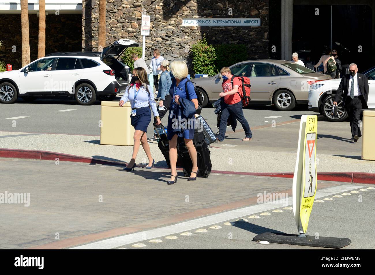 Southwest Airlines female flight crew exiting the Palm Springs International Airport, after a flight. Stock Photo