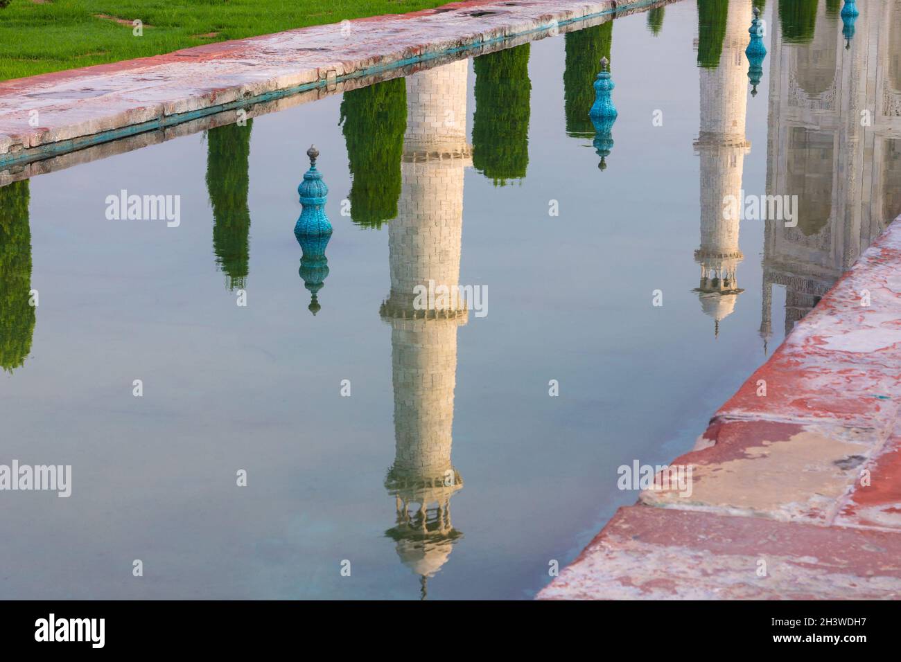 Minarets of the Taj Mahal reflected in the garden's pool Stock Photo