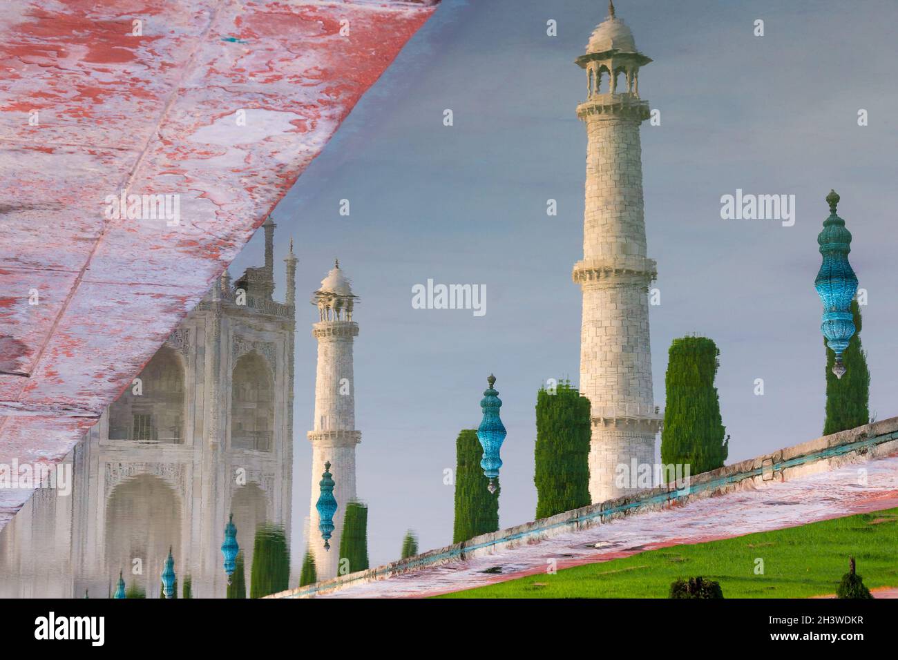 Minarets of the Taj Mahal reflected in the garden's pool Stock Photo