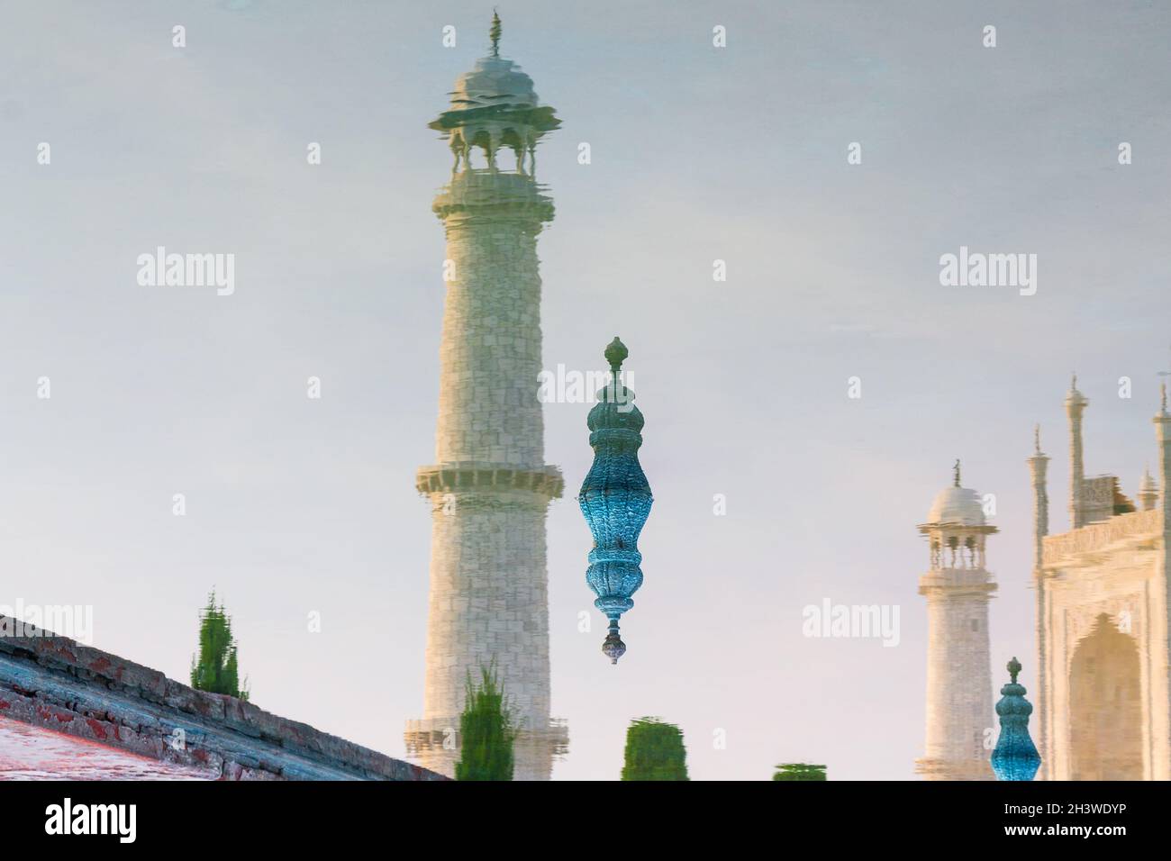 Reflection of the Taj Mahal's minarets photographed in August. This famous mausoleum has been built for Mumtaz Mahal by her husb Stock Photo