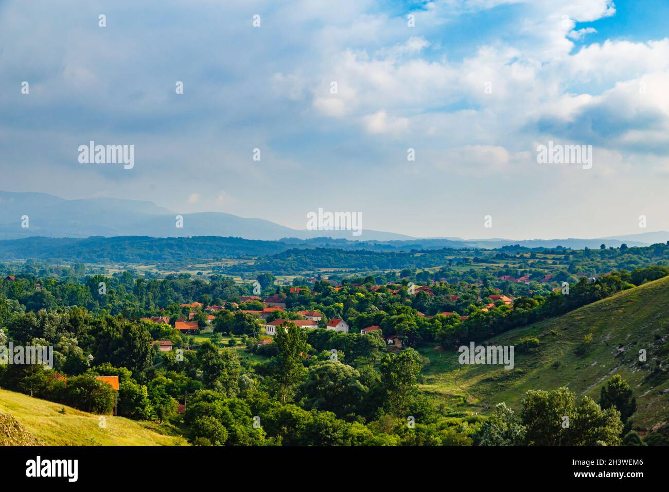 Cloudy sky over the green hills in spring Stock Photo - Alamy