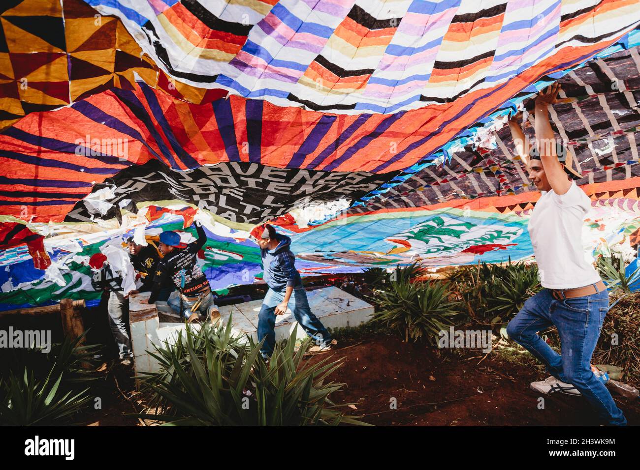 Giant kite festival in a cemetery - famous, traditional day of the dead celebration in Santiago, Guatemala. Stock Photo