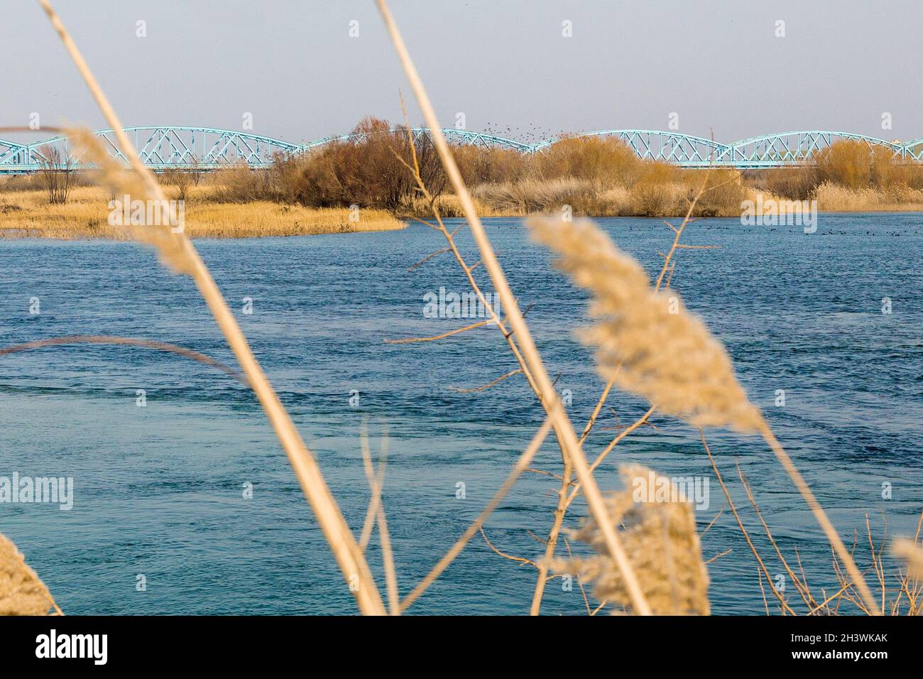General view of the Euphrates river and the railway bridge over it in Jarablus city of Aleppo, Syria. Stock Photo
