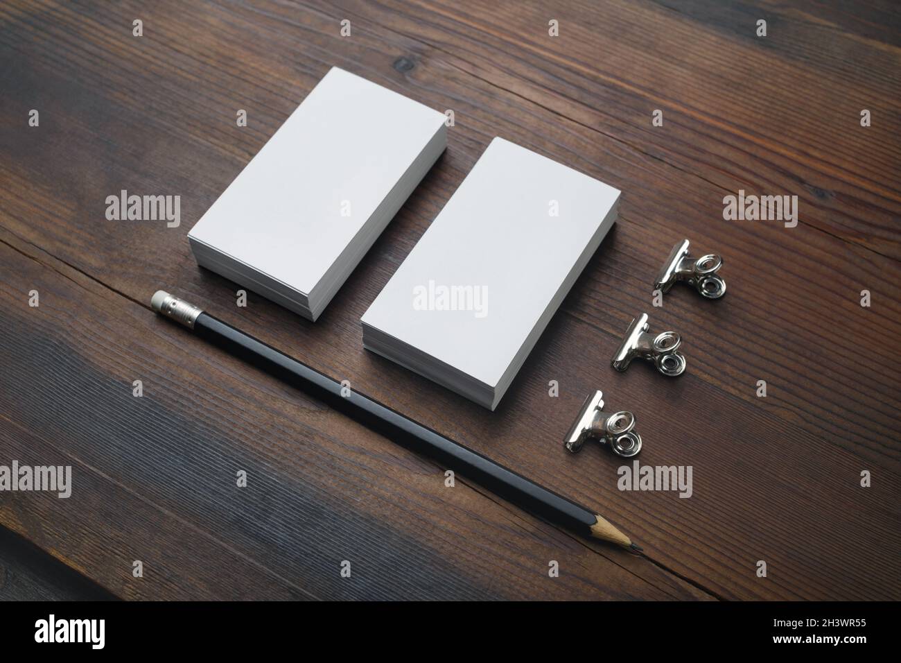 Business cards, pencil, paper clips Stock Photo