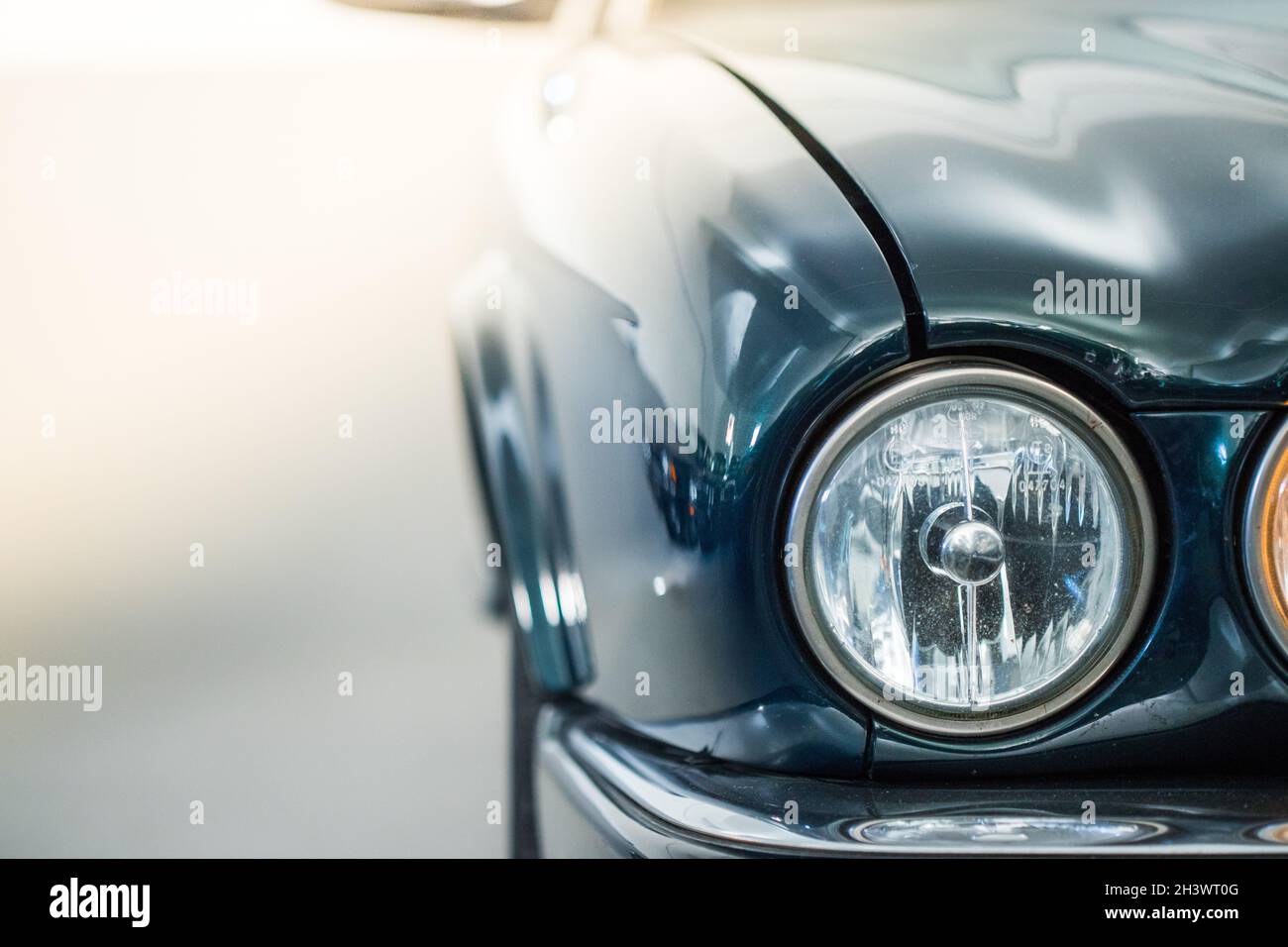 Circle lights of a polished green vintage car Stock Photo Alamy