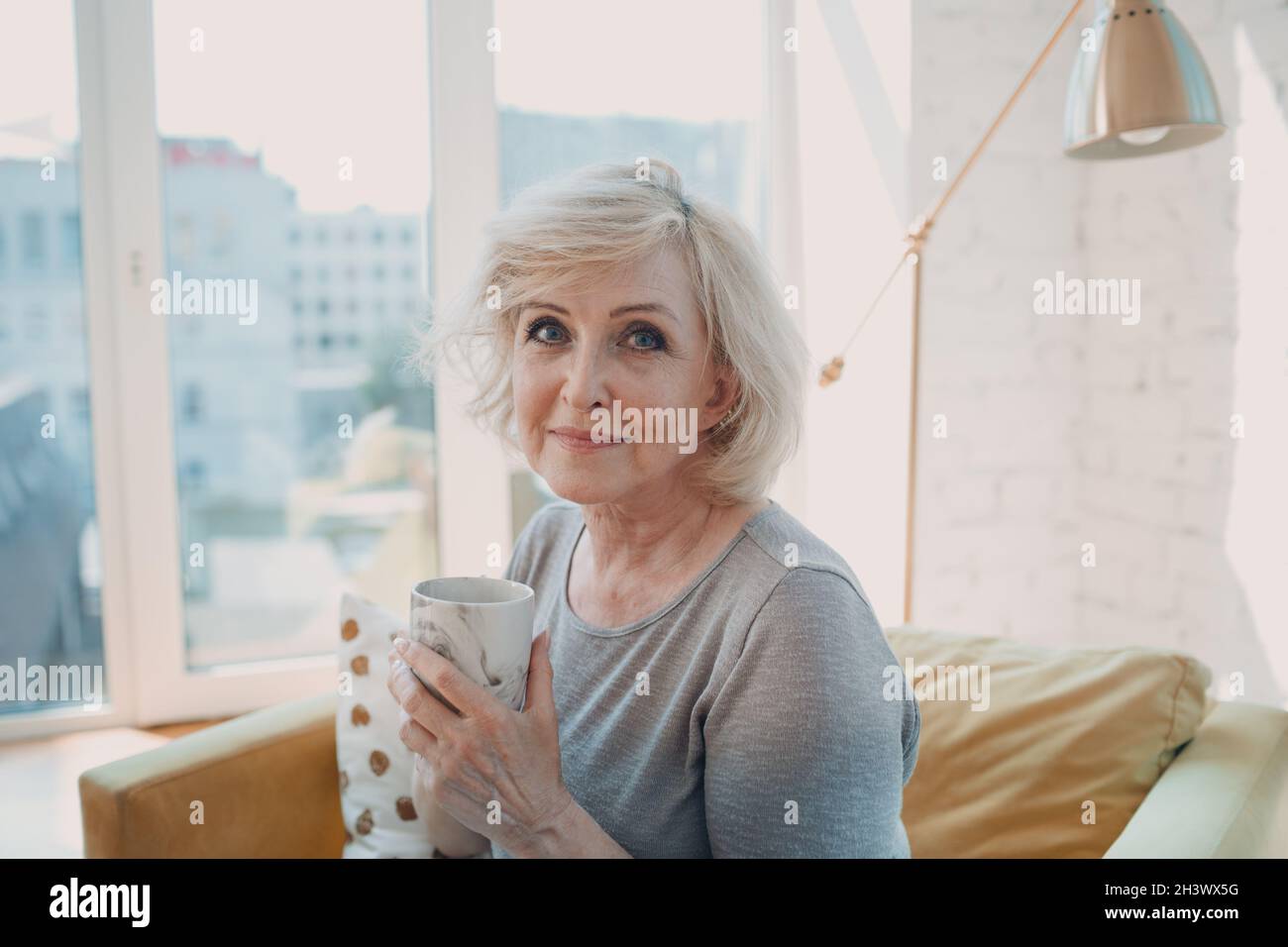 Elderly caucasian old aged woman enjoying afternoon tea at home Stock ...