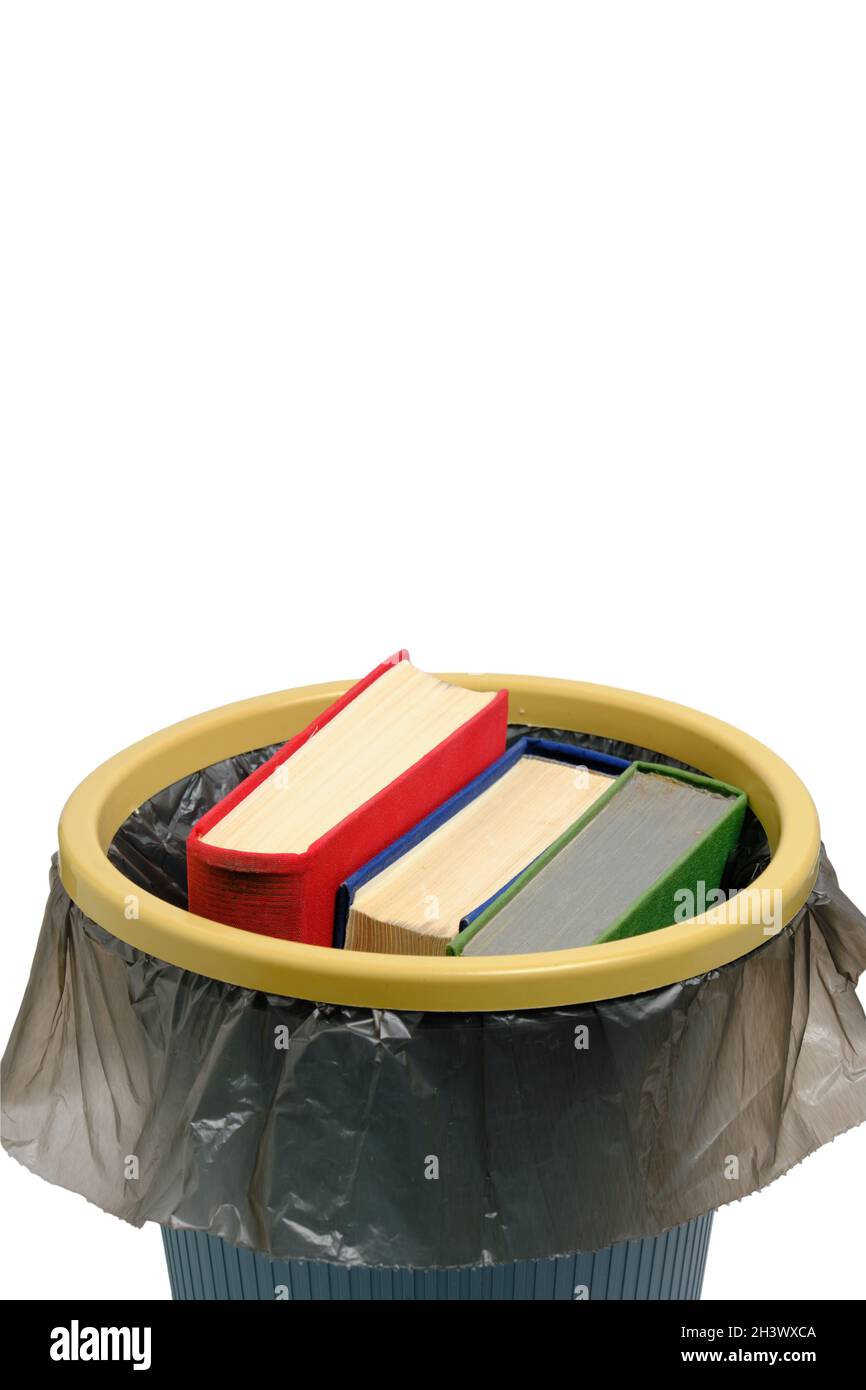 Trash can and the books thrown into it, on a white background, are ...