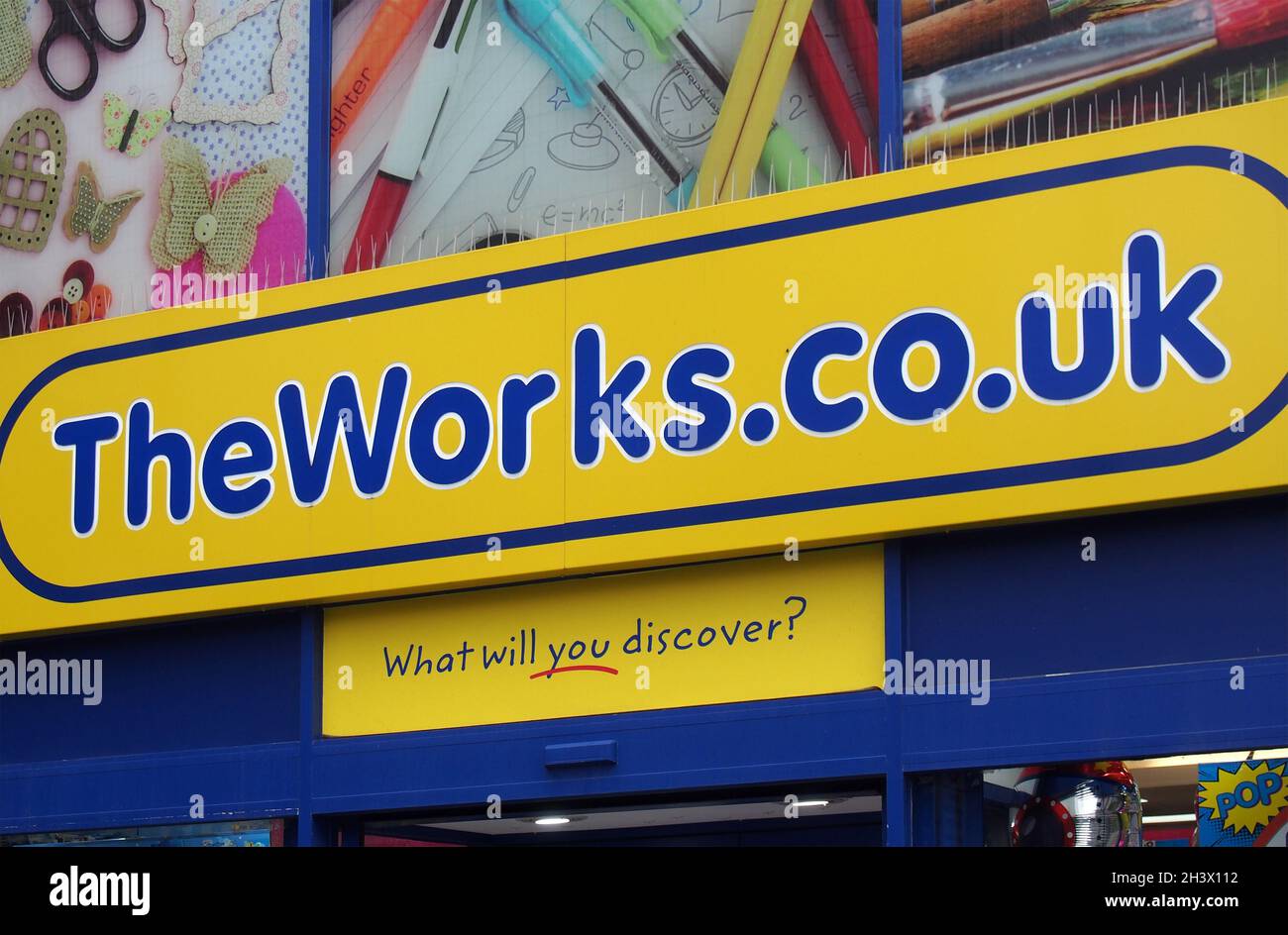 Sign and slogan above the entrance of the works books shop and stationary store on Kirkgate in leeds city centre Stock Photo