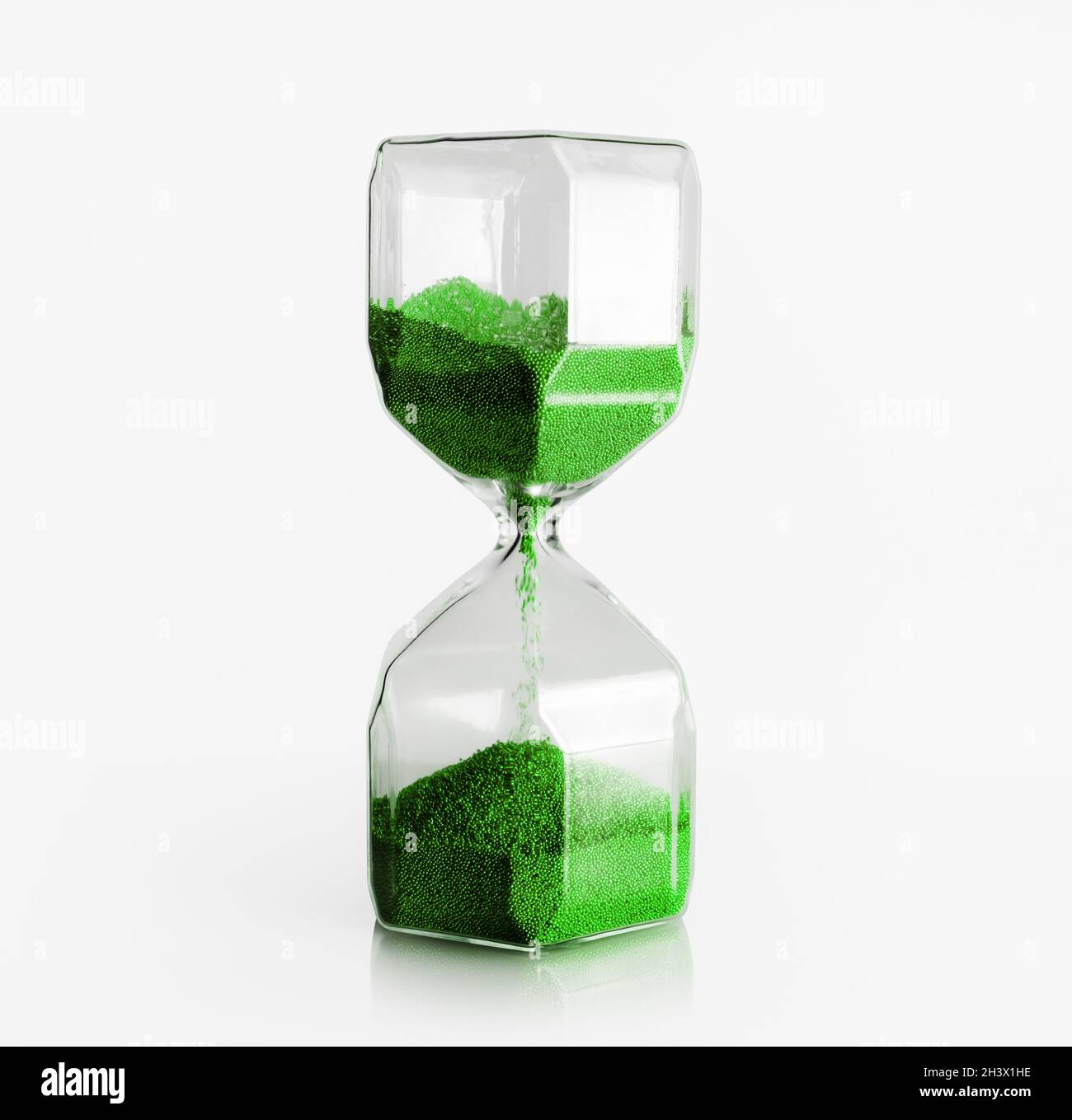 Hourglass with green filler Stock Photo