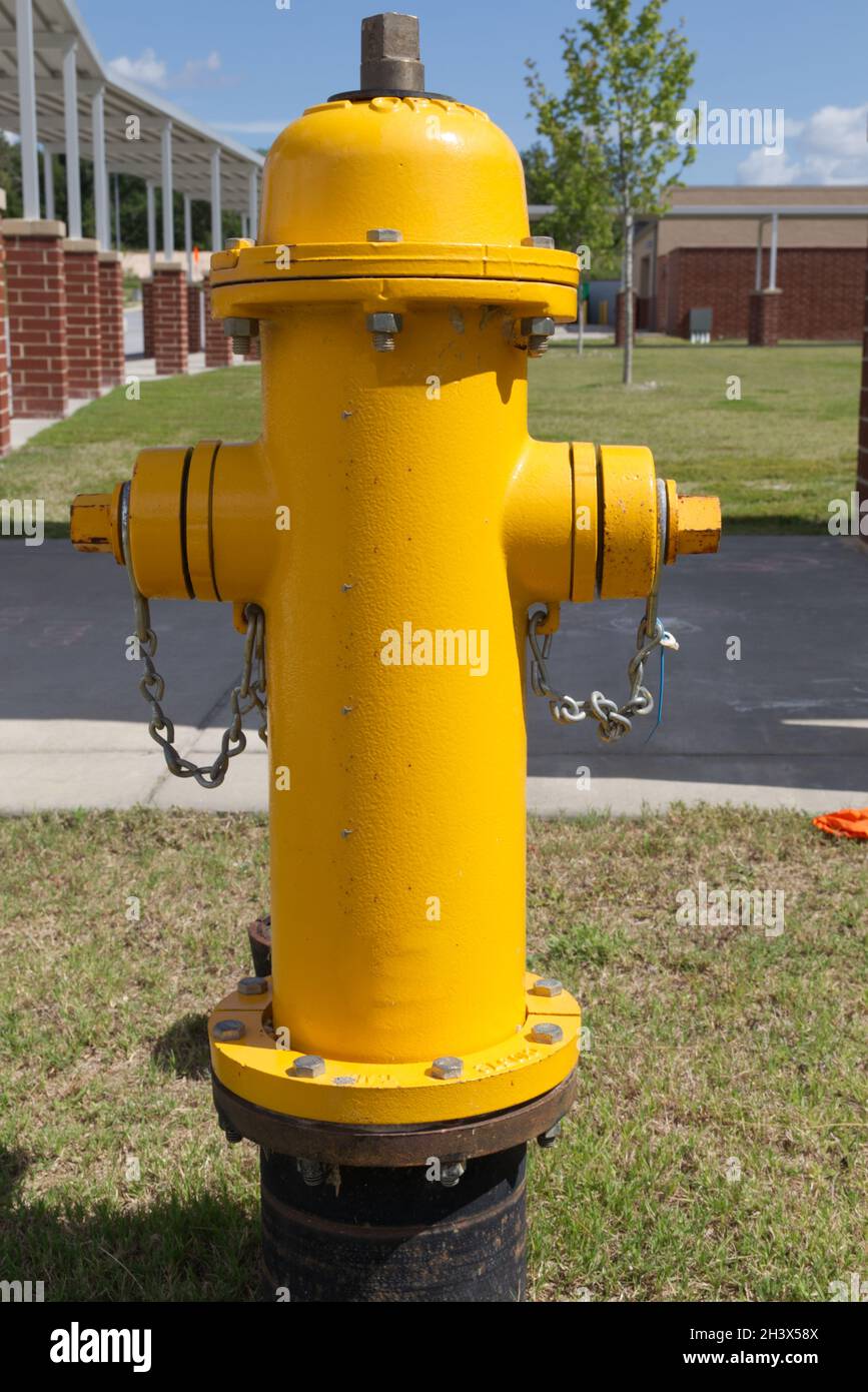 A new yellow fire hydrant and buildings in Stock Photo Alamy