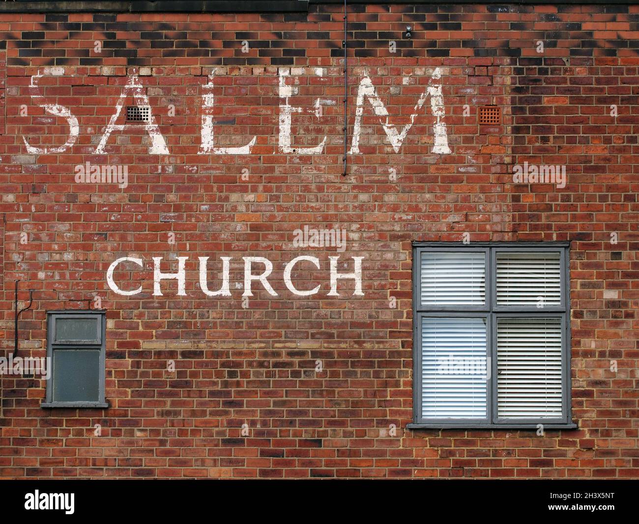 Old painted sign on the historic salem chapel as the oldest surviving chapel in the city and the birthplace of leeds united foot Stock Photo