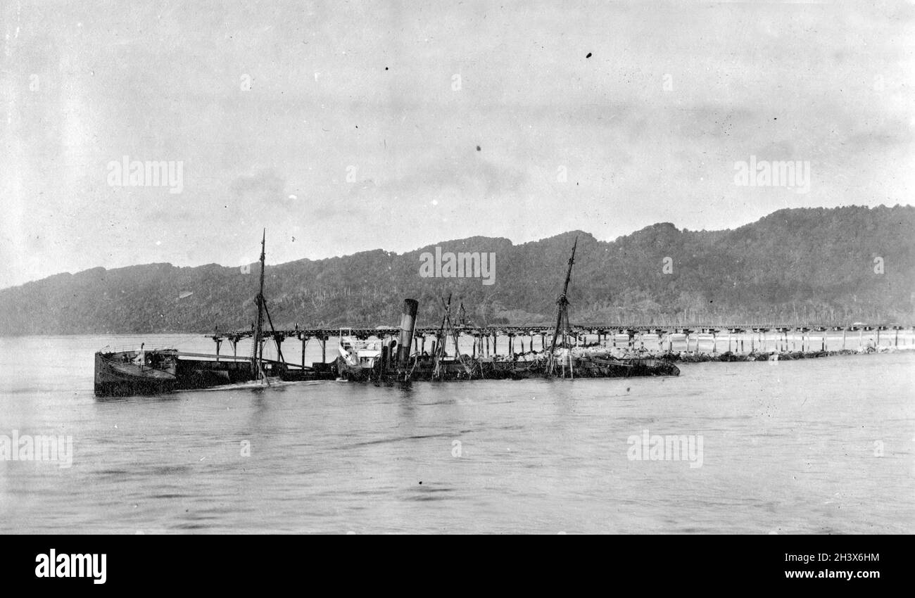 A sunken ship in the mouth of the Buller River in Westport, New Zealand, 1909. Stock Photo