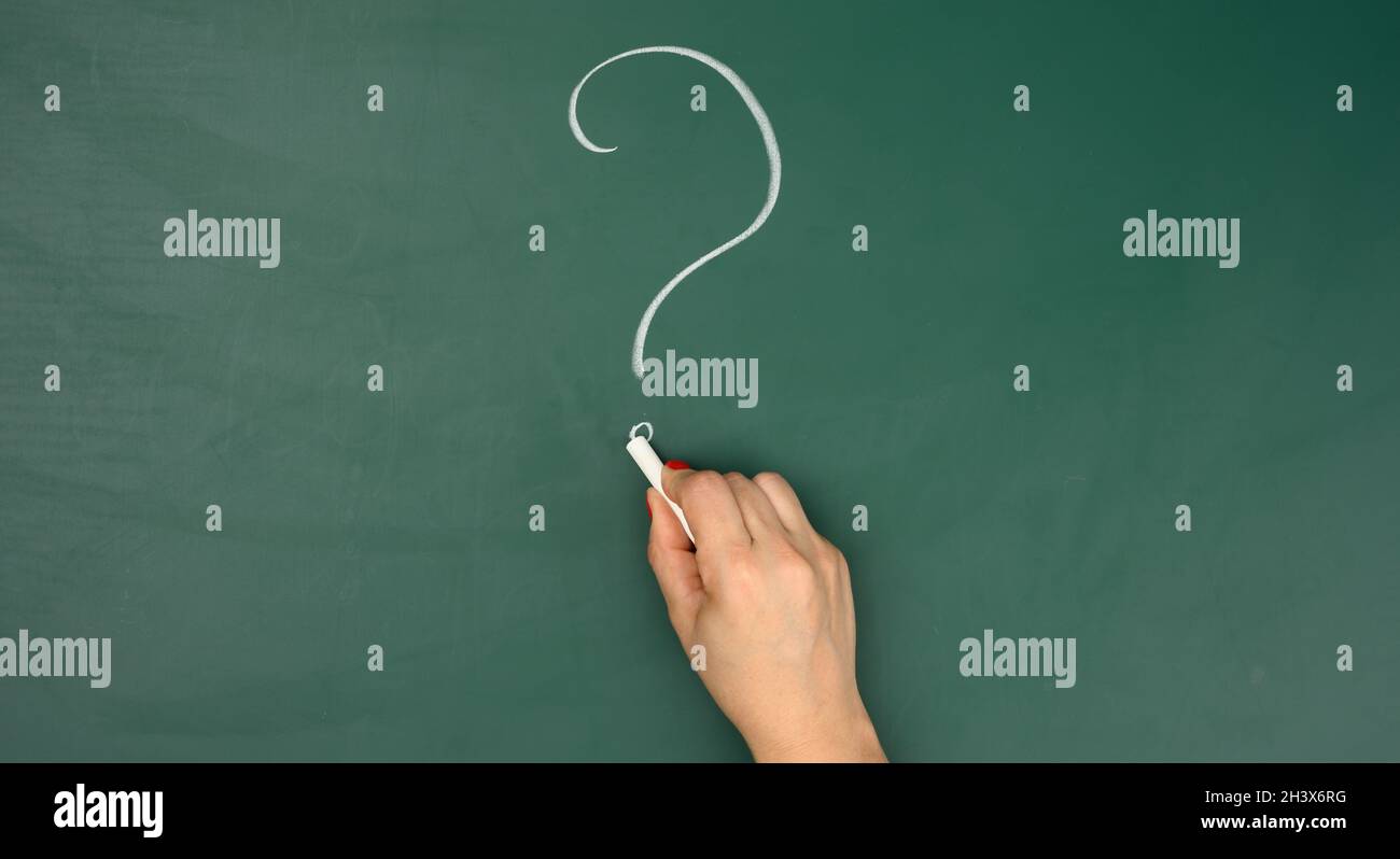 White chalk drawn question mark and female hand. Question and answer ...