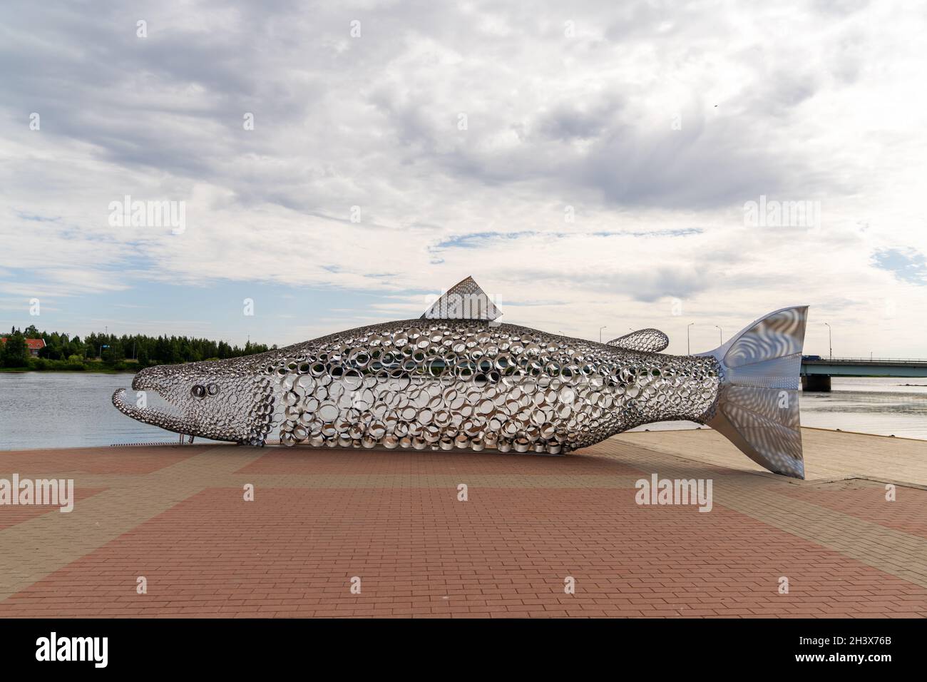 View of the anniversary celebration sculpture of a large metal salmon in the city center of Tornio Stock Photo