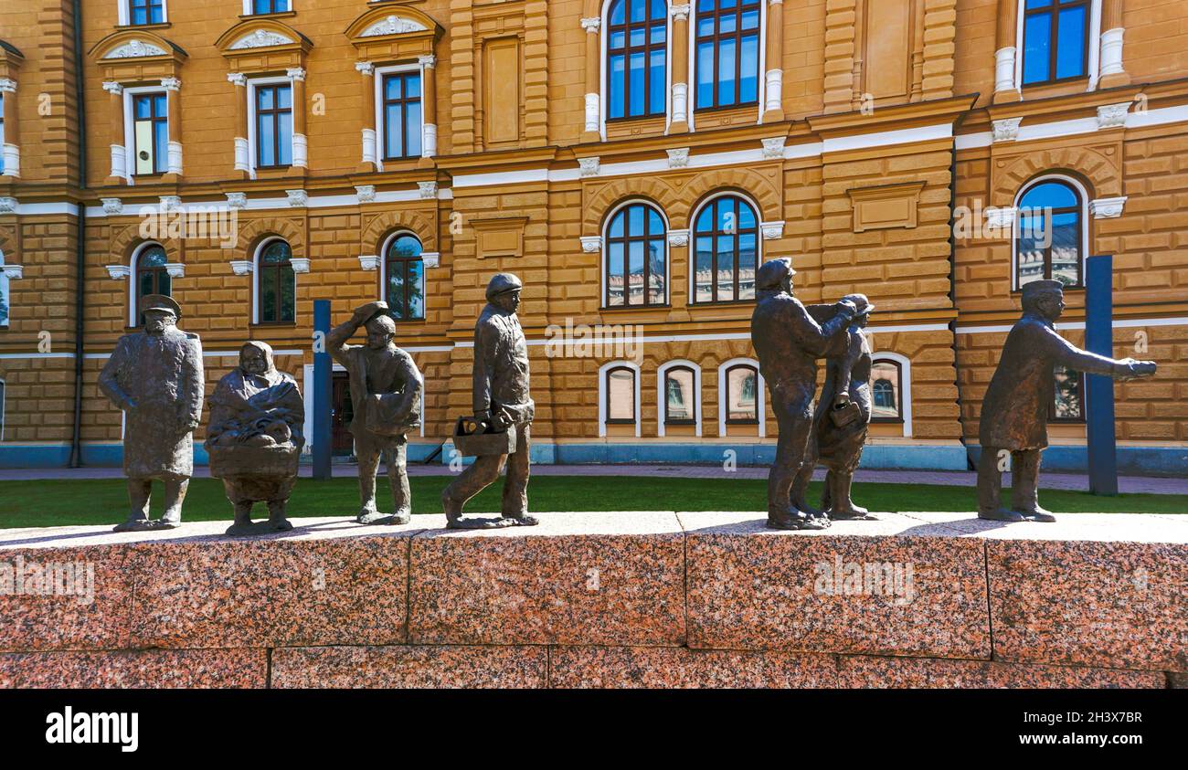 View of the Ajan Kulku bronze statues commemorating the city history of Oulu in the park in front of the city hall Stock Photo