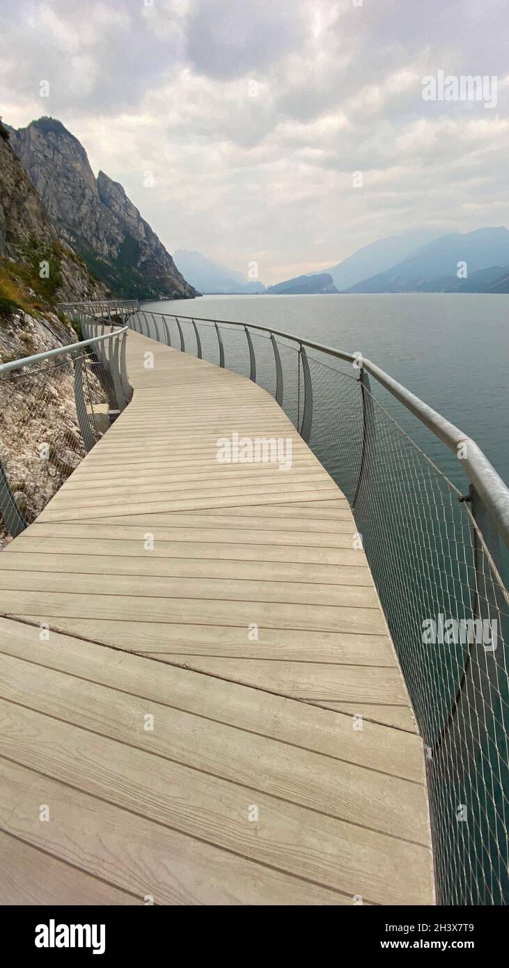 Cycle path in Limone sul Garda at the western bank of Lake Garda. Lombardy, northern Italy, Europe. Stock Photo