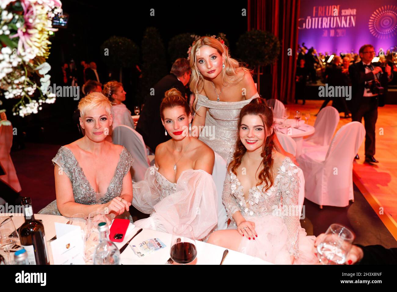 Leipzig, Germany. 30th Oct, 2021. Cheryl Shepard (l-r), Rebecca Kunikowski, Alexa Maria Surholt and Klaudia Giez are seated at the 26th Leipzig Opera Ball under the motto 'Joy of Beautiful Gods'. Due to the Corona pandemic, the event had to be cancelled last year. Credit: Gerald Matzka/dpa/Alamy Live News Stock Photo
