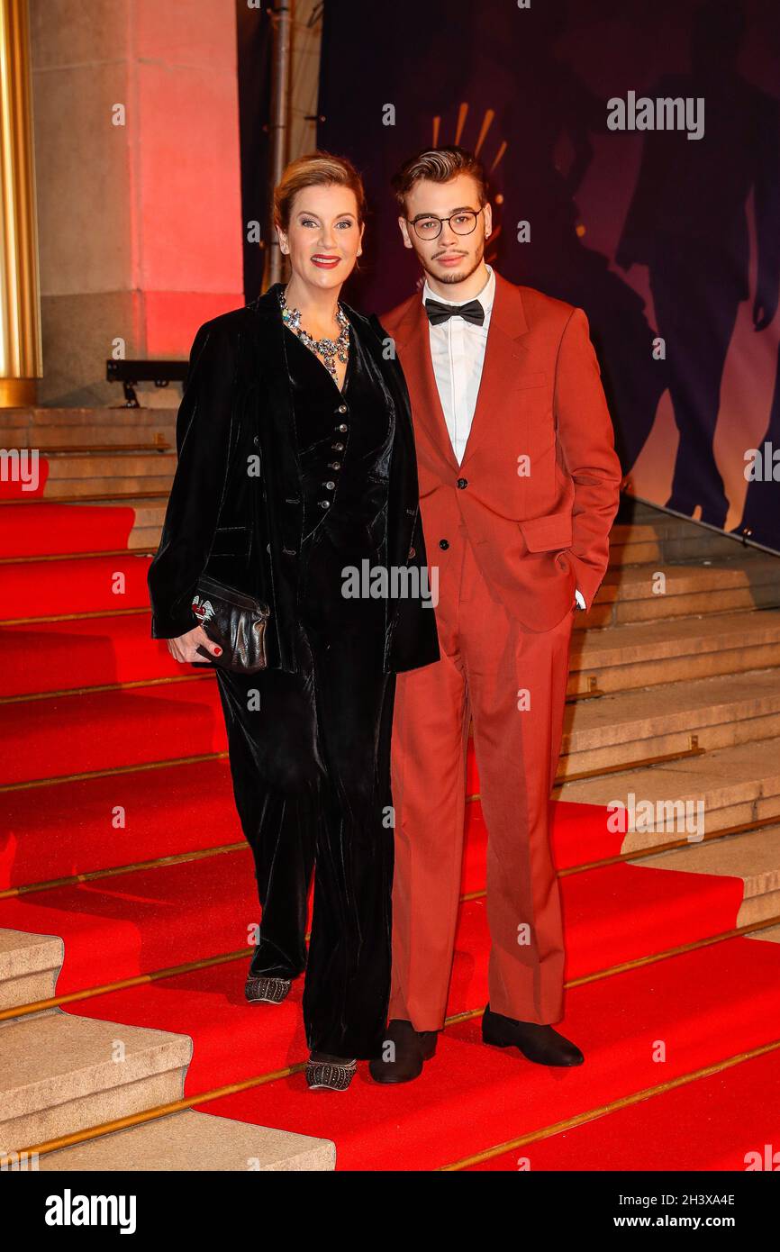 Leipzig, Germany. 30th Oct, 2021. Alexa Maria Surholt and son Arthur Suholt come to the 26th Leipzig Opera Ball under the motto 'Joy of Beautiful Gods'. Due to the Corona pandemic, the event had to be cancelled last year. Credit: Gerald Matzka/dpa/Alamy Live News Stock Photo