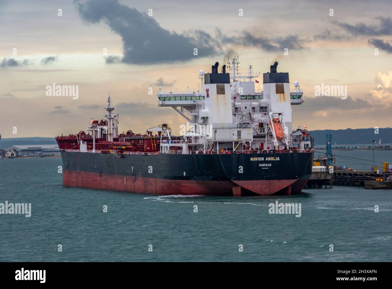 large oil tanker ship at fawley marine terminal in port of southampton, solent, southampton docks, fawley oil refinery. exxon mobil processing plant Stock Photo