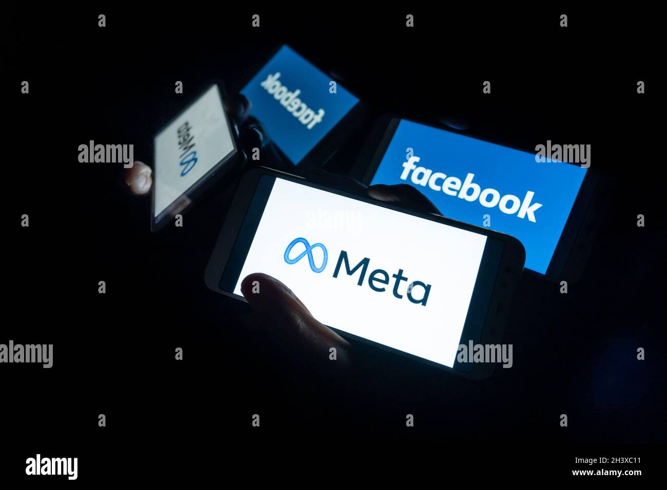 In this photo illustration, Meta and Facebook logos seen displayed on a