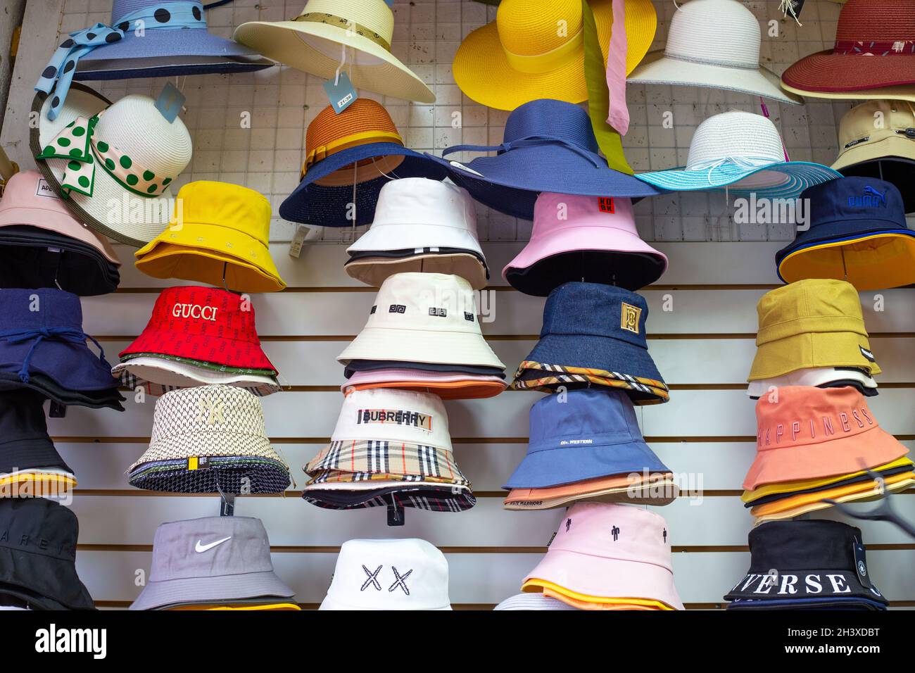 Shop window with summer hats and panama 
