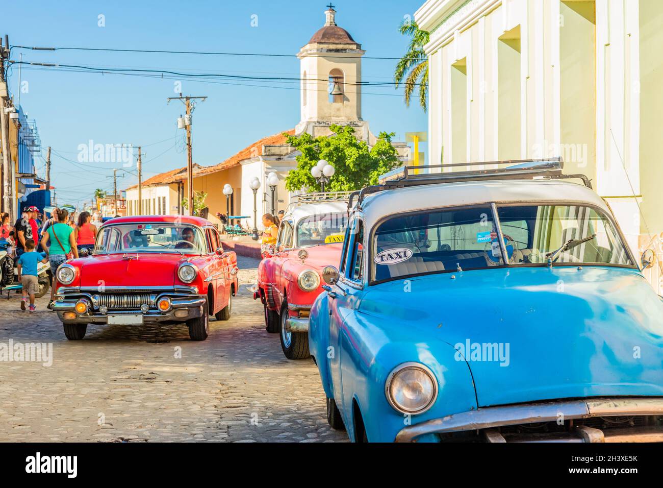 Old american retro cars in historical center of Trinidad, Cuba Stock Photo