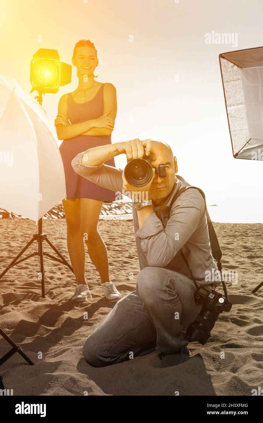 Professional photographer working on seaside Stock Photo