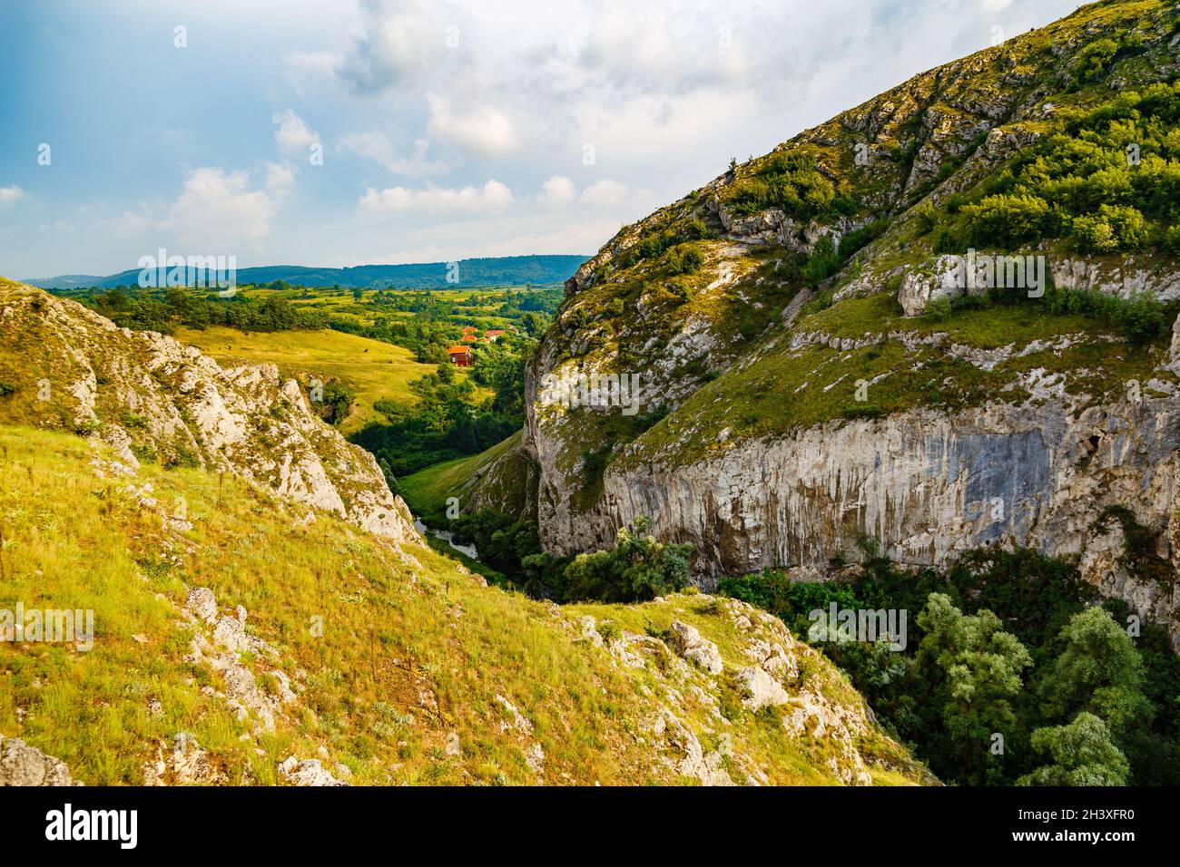 Cloudy sky over the green hills in spring Stock Photo - Alamy