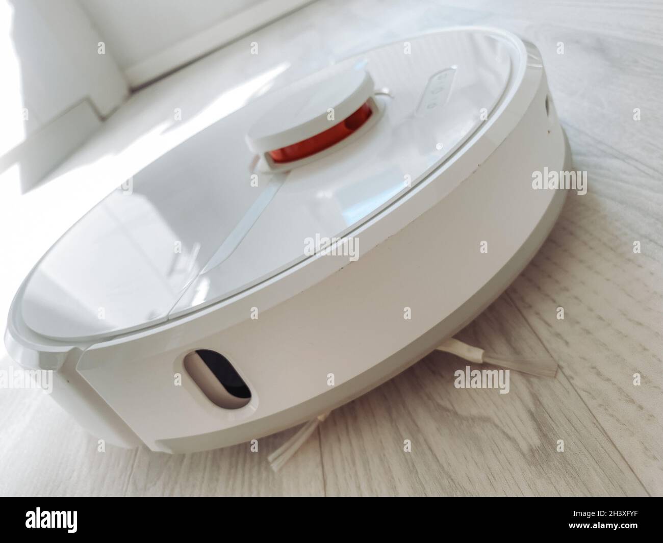 FRANKFURT, GERMANY Oct 07, 2021 A whitecolored vacuum cleaner robot