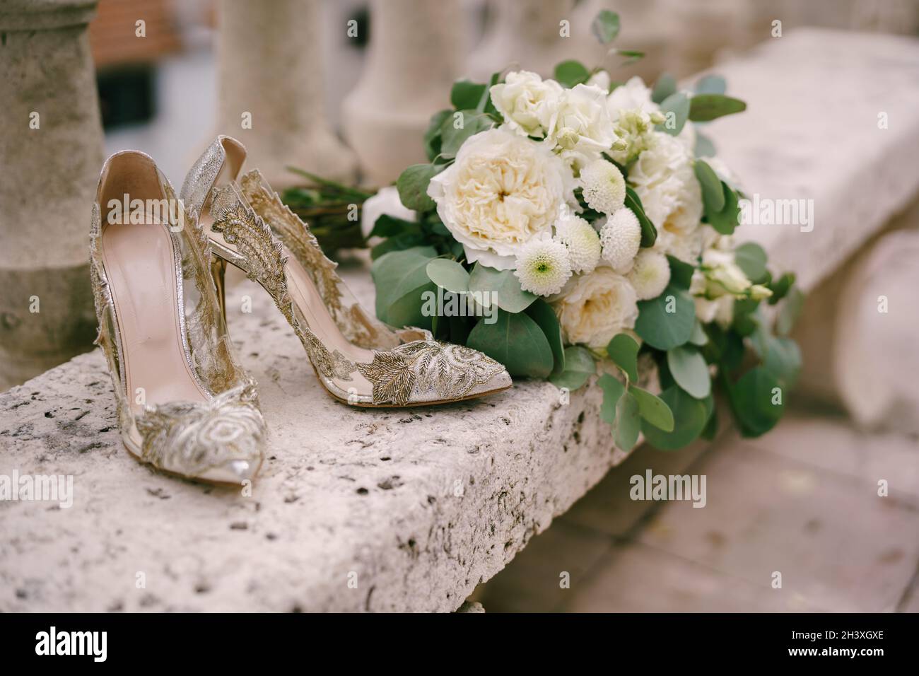 Elegant women's shoes with patterns on high heels on a bench with a