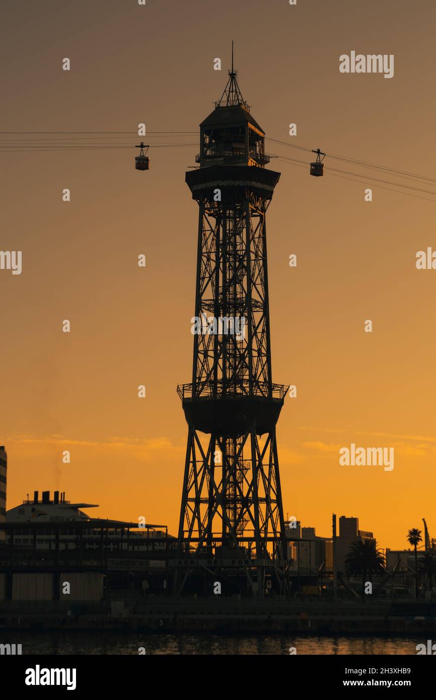 Overhead cable car on sunset. Trolley silhouette. Sunset photography. Ropeway. Stock Photo