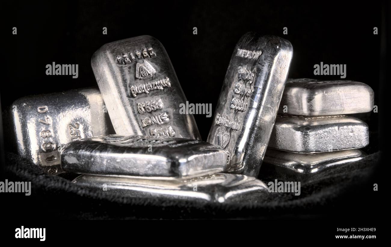 Silver bullion bars, various weights and sizes Stock Photo