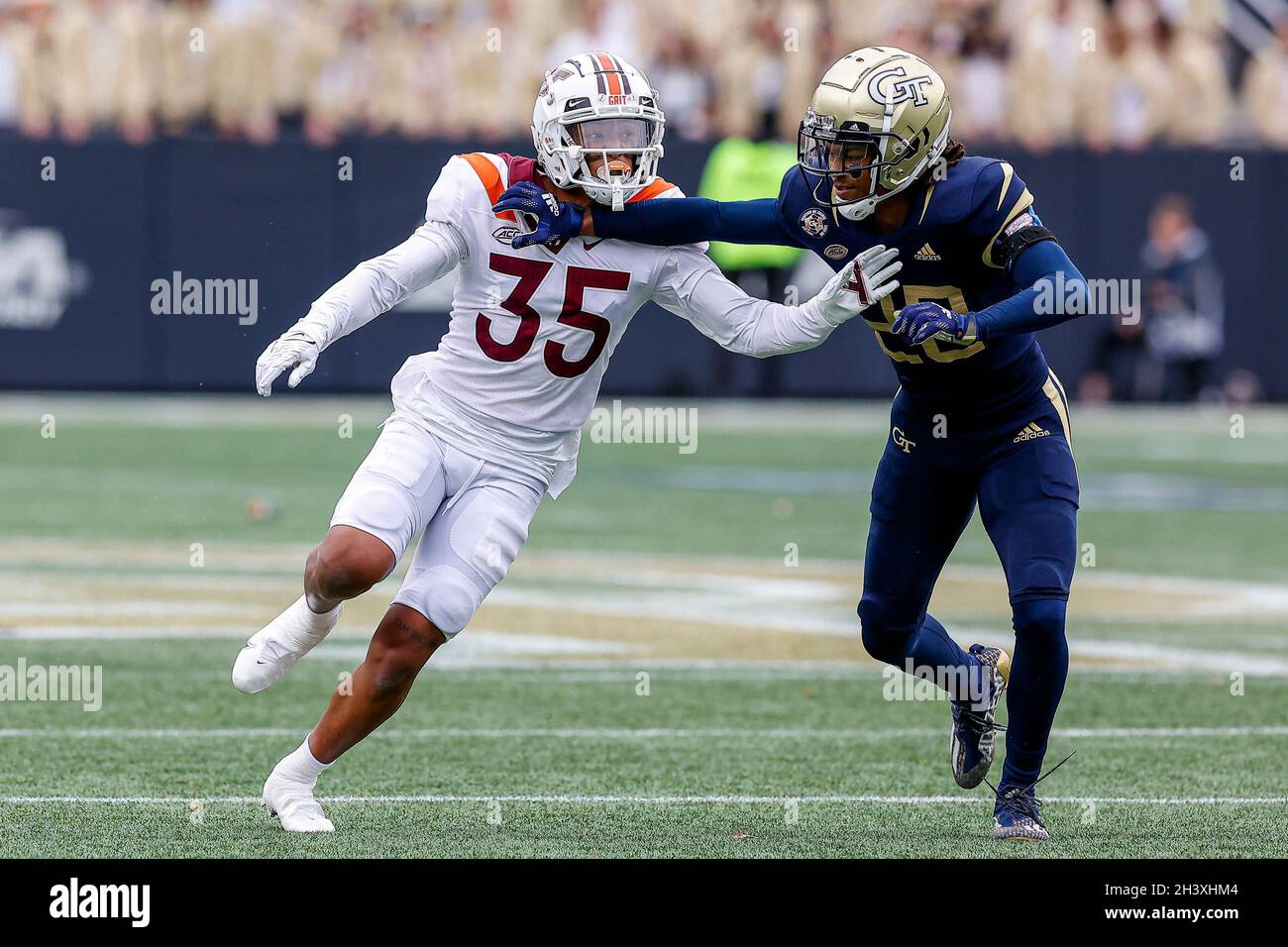 Atlanta, Georgia. 30th Oct, 2021. Virginia Tech's Keondre Ko (35) tries to  get past the block of Georgia Tech's Miles Brooks (20) during the NCAA  football game featuring the Georgia Tech Yellow