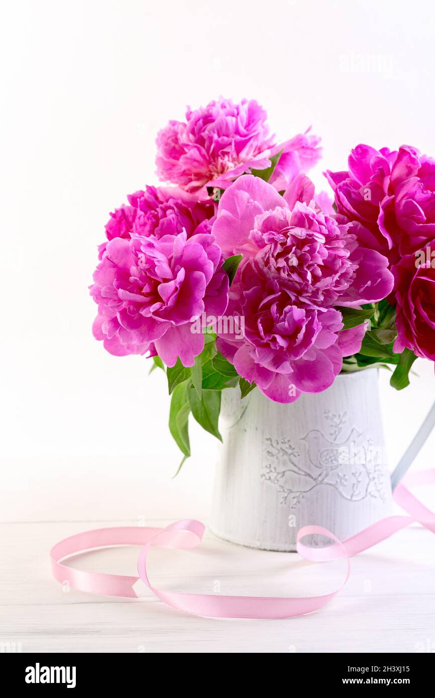 Pink peonies in a vintage vase. Stock Photo