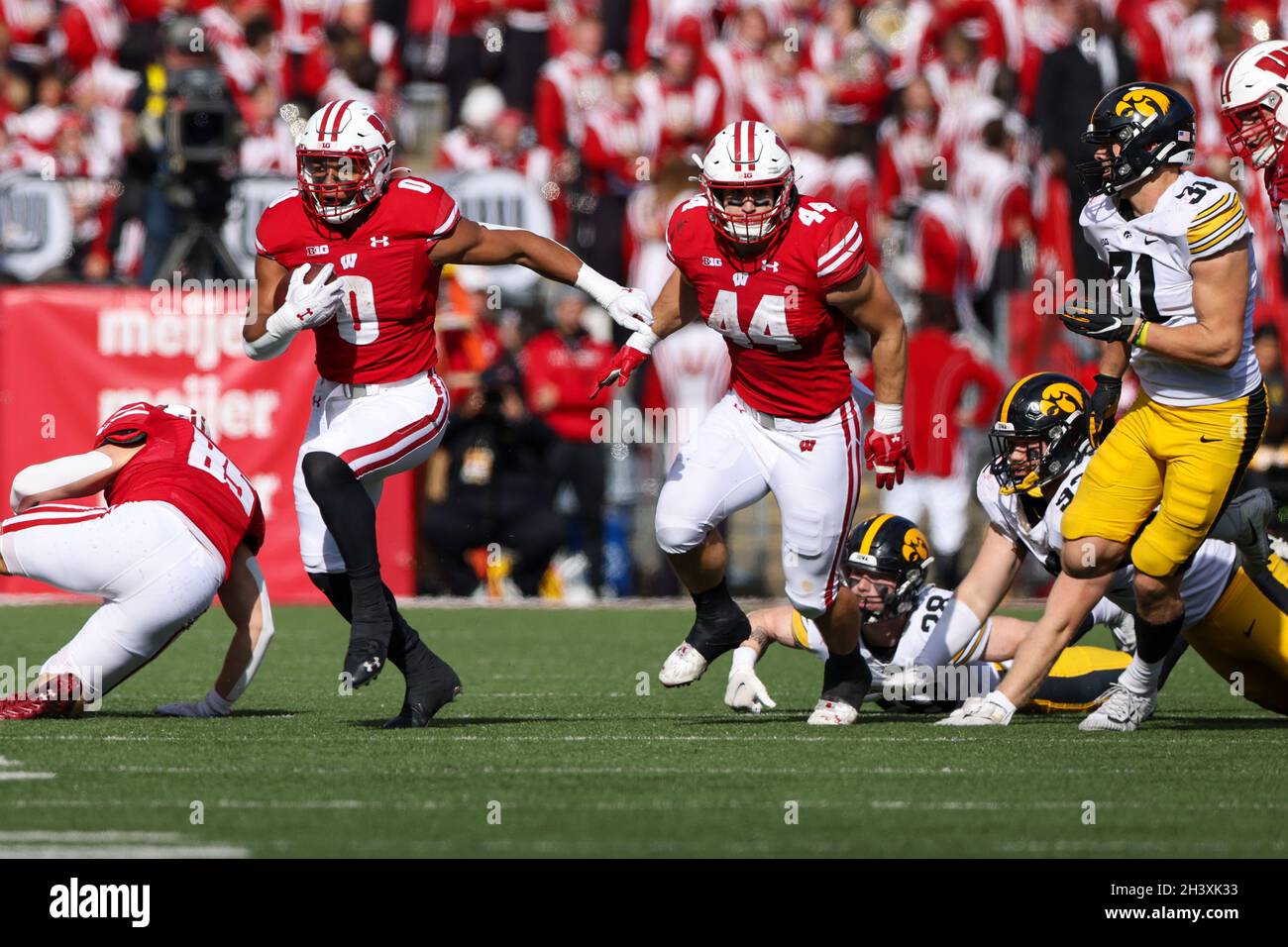 Madison, WI, USA. 30th Oct, 2021. Wisconsin Badgers running back Braelon Allen (0) rushes the ball during the NCAA Football game between the Iowa Hawkeyes and the Wisconsin Badgers at Camp Randall Stadium in Madison, WI. Darren Lee/CSM/Alamy Live News Stock Photo