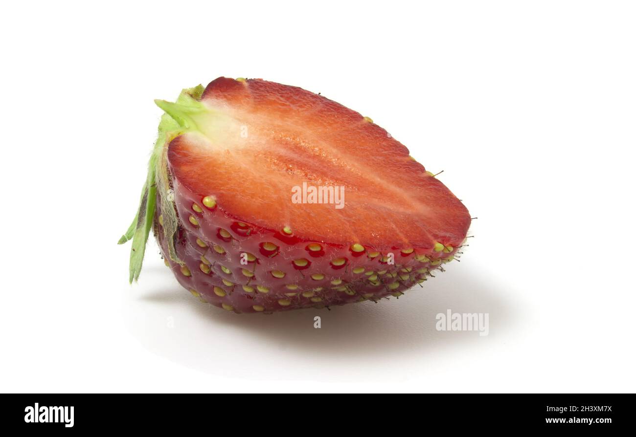 Isolated half of strawberry on a white background. Stock Photo