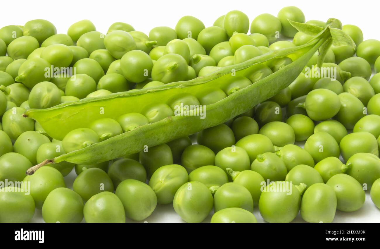 Beans of young sweet peas. Nutritious vegetarian food. Stock Photo