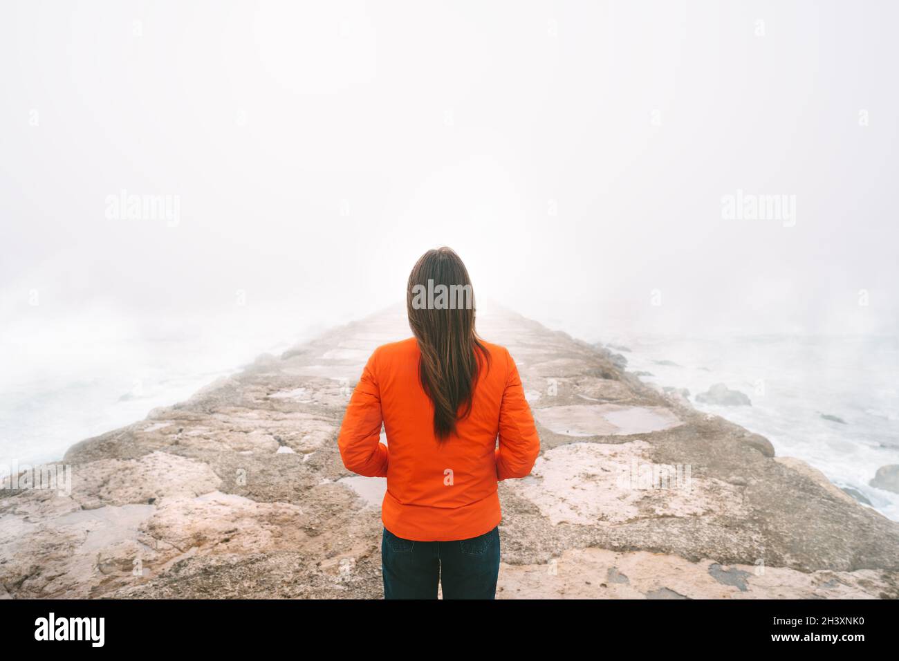 Woman alone on empty road hi-res stock photography and images - Alamy