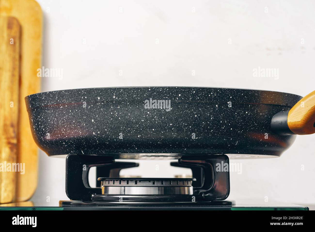 Frying pan on the gas stove in a kitchen Stock Photo Alamy