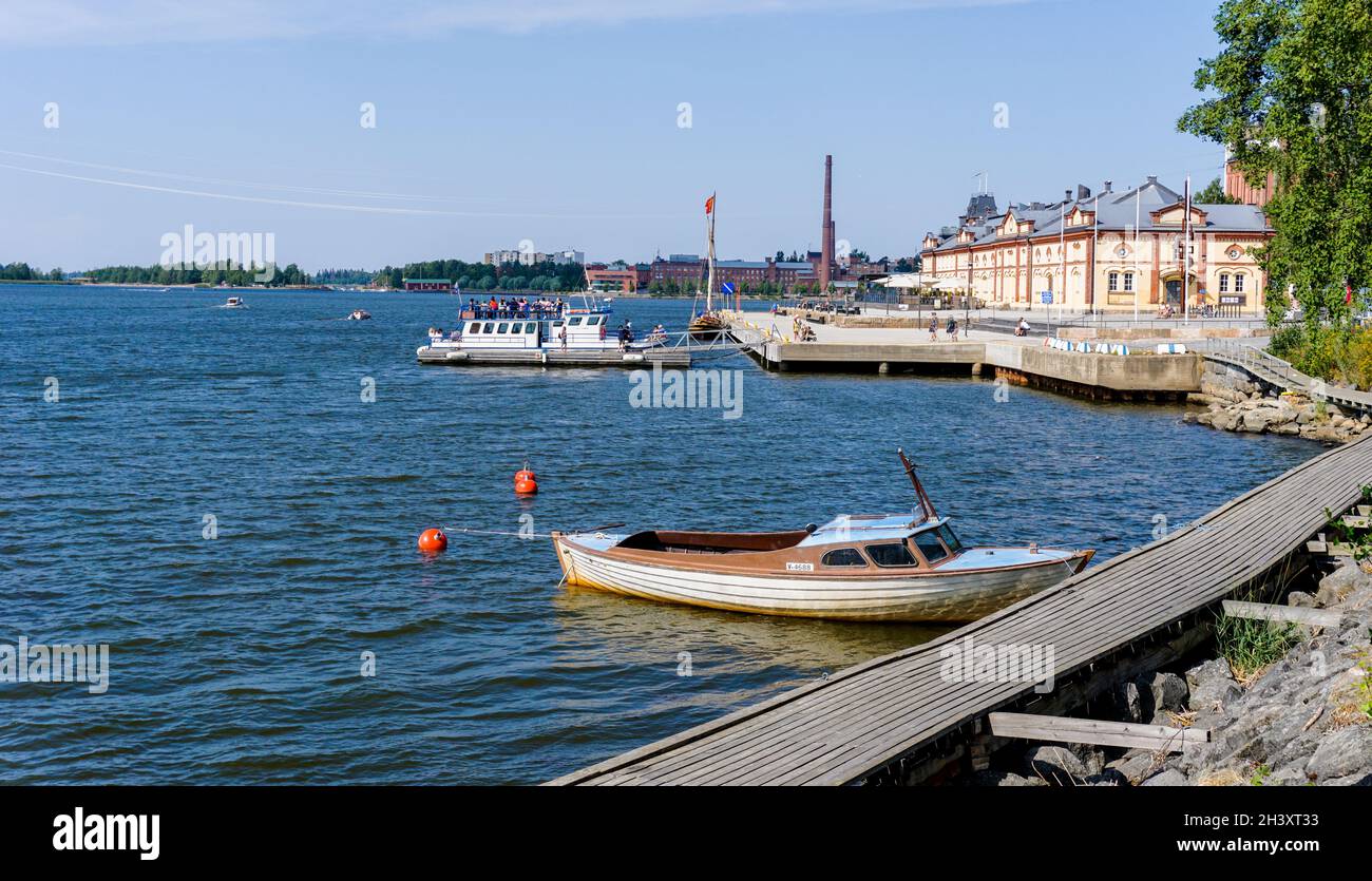 Vaasa harborfront with the old harbormaster building and several boats at the docks Stock Photo