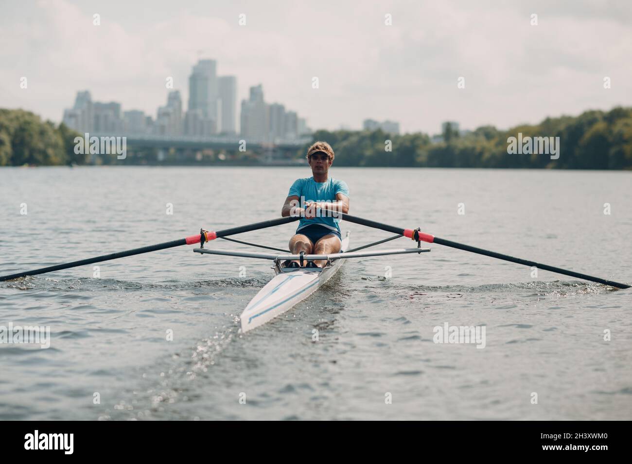 Sportsman single scull man rower rowing on boat Stock Photo Alamy
