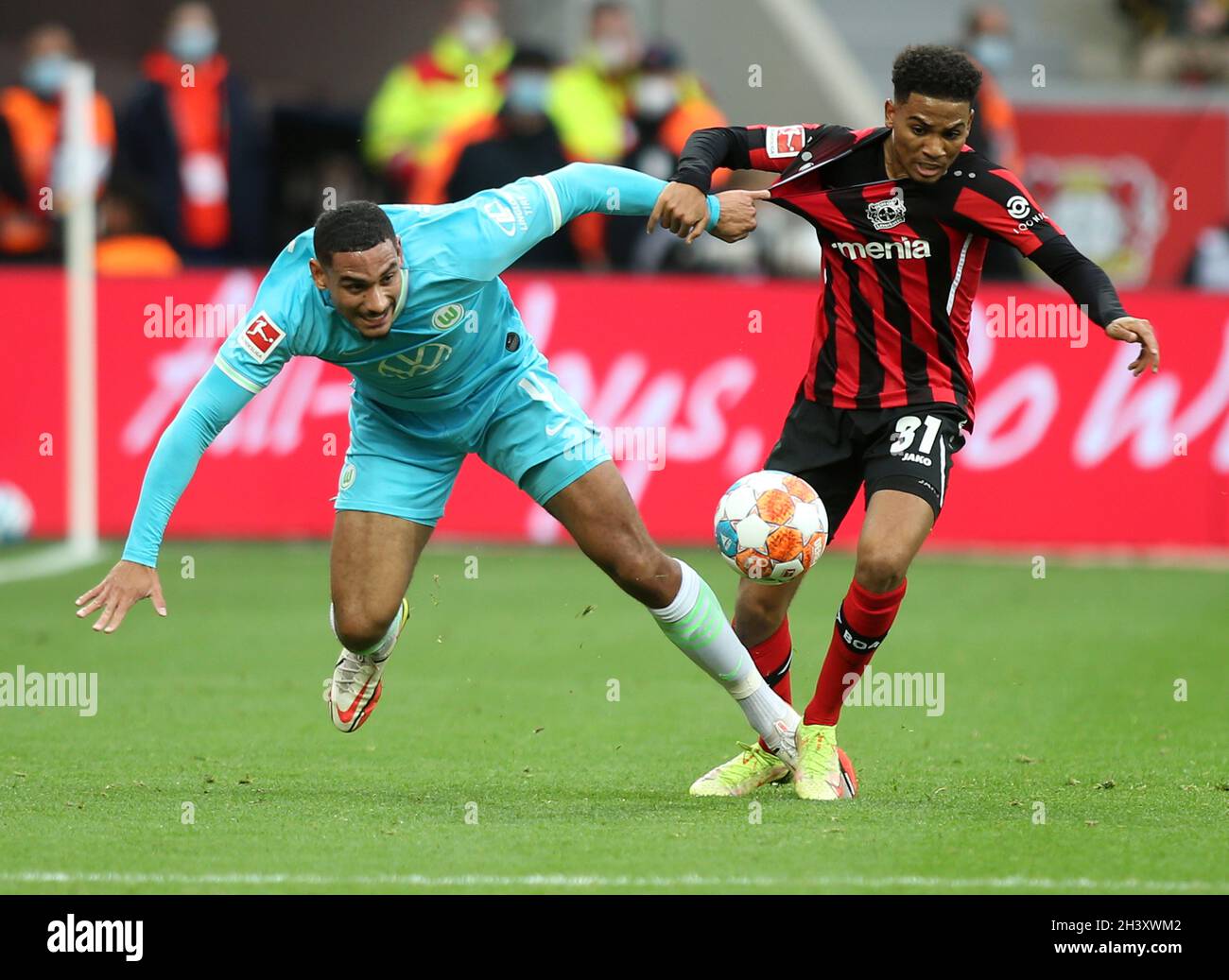 Amine Adli of Bayer 04 Leverkusen, (right ), and Maxence Lacroix of
