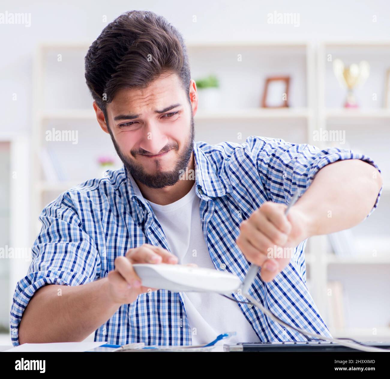 Frustrated young man due to weak internet reception Stock Photo - Alamy