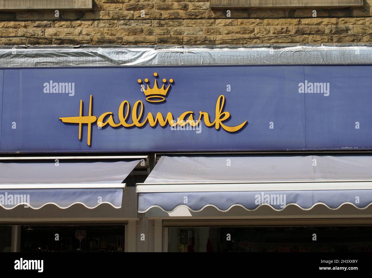 Sign and logo above a hallmark card and gift store in brighouse town